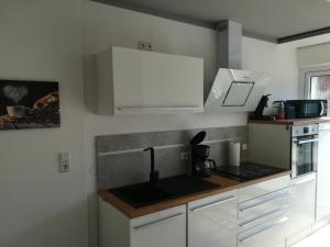 Kuchyň nebo kuchyňský kout v ubytování Ferienhaus Frank Saathoff