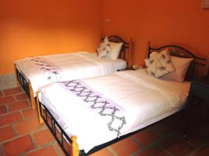 Letto o letti in una camera di PianoPiano B&B