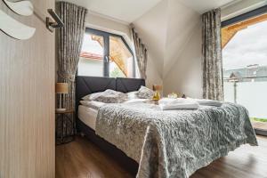 Posteľ alebo postele v izbe v ubytovaní Apartamenty Jedlina