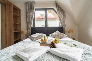 Posteľ alebo postele v izbe v ubytovaní Apartamenty Jedlina