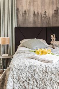 Posteľ alebo postele v izbe v ubytovaní Apartamenty Jedlina