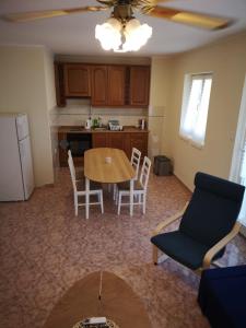 a kitchen with a table and chairs in a room at Villa Zoe Privlaka-Zadar in Privlaka