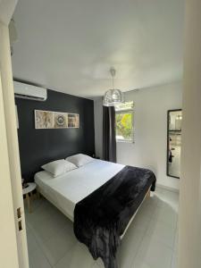 Postel nebo postele na pokoji v ubytování APPARTEMENT T2 ROUTE DES SALINES