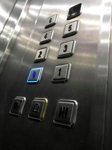 a close up of the buttons of an elevator at F11 Modern and Bright Apartment in Malta in Msida