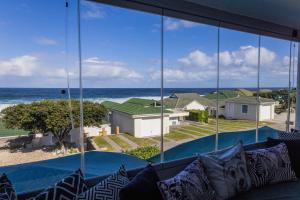 a view of the ocean from the living room of a house at 67 Whale Rock Estate, Hermanus in Hermanus