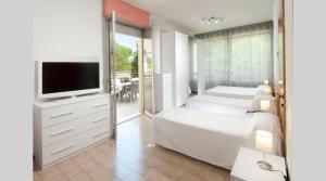 Postel nebo postele na pokoji v ubytování Hotel Le Querce