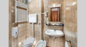 Koupelna v ubytování Hotel Le Querce