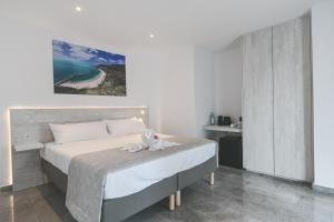 a bedroom with a bed with a towel on it at Villa Boutique Tenerife in Adeje