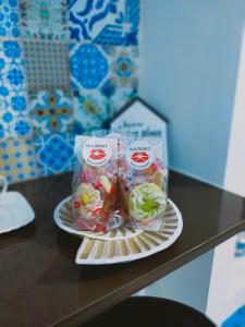 a plate with two bags of food on a table at Casa Mediterranea in Pachino
