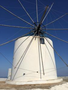a close up of a white windmill at Windmill Villas in Artemonas