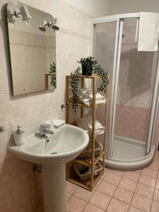 a bathroom with a sink and a shower at Belle Vue de St Gervais in Saint-Gervais-les-Bains