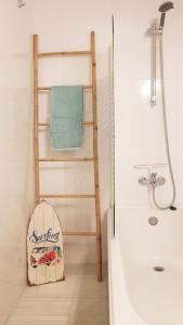 a bathroom with a wooden ladder next to a bath tub at Beach House Casa Luna, Calahonda Marbella, Mijas Costa in Sitio de Calahonda