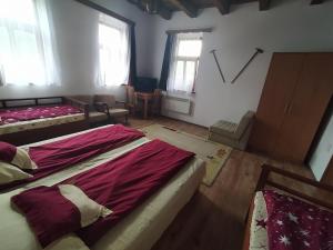 Posteľ alebo postele v izbe v ubytovaní Heni Vendégháza