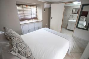 Postelja oz. postelje v sobi nastanitve BON Hotel Rustenburg