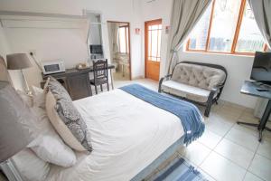 Postelja oz. postelje v sobi nastanitve BON Hotel Rustenburg
