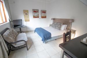 Postelja oz. postelje v sobi nastanitve BON Hotel Rustenburg