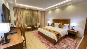 Katil atau katil-katil dalam bilik di Alsahwa Hotel