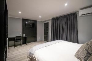 Postelja oz. postelje v sobi nastanitve BON Hotel Rustenburg