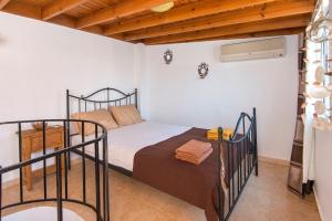 a bedroom with two bunk beds in a room at Old Town Roloi House in Rhodes Town