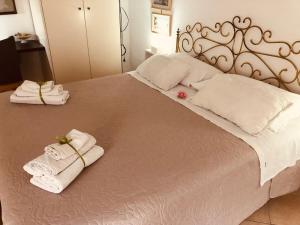 Posteľ alebo postele v izbe v ubytovaní Caio Asinio Apartment