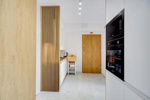 Televízia a/alebo spoločenská miestnosť v ubytovaní Apartament Ola + 5 fotografií