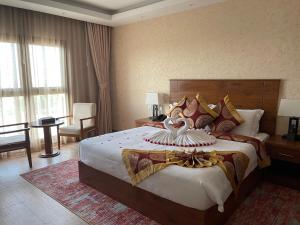 Katil atau katil-katil dalam bilik di Alsahwa Hotel