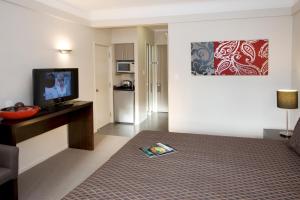 Una cama o camas en una habitación de Apollo Hotel Rotorua