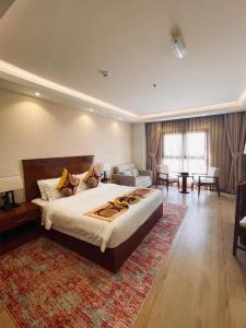 Katil atau katil-katil dalam bilik di Alsahwa Hotel