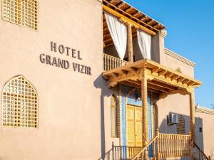 a building with a hotel grand ville sign on it at Grand Vizir Hotel in Khiva