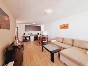a living room with a couch and a table at Top Complex in Sveti Vlas +23 photos
