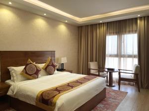 Katil atau katil-katil dalam bilik di Alsahwa Hotel