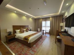 Katil atau katil-katil dalam bilik di Alsahwa Hotel