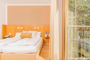 Postel nebo postele na pokoji v ubytování Art Hotel Vienna