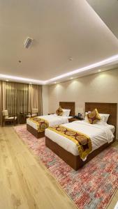 Katil atau katil-katil dalam bilik di Alsahwa Hotel