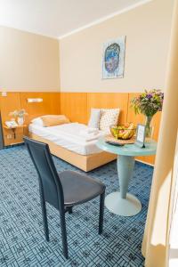 Postel nebo postele na pokoji v ubytování Art Hotel Vienna