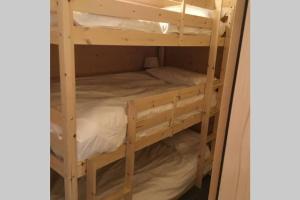 a pair of bunk beds in a room at Modern Comfortable Chalet with large terrace in Morzine