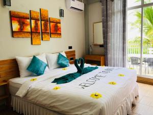 Voodi või voodid majutusasutuse IRIS Beach Residence toas