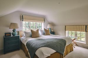 En eller flere senger på et rom på Bridlepath Cottage