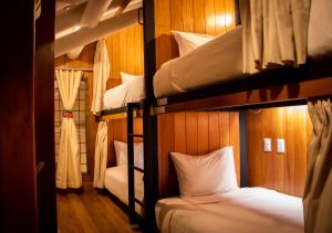 Postel nebo postele na pokoji v ubytování Nao Victoria Hostel