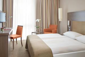 Postel nebo postele na pokoji v ubytování IntercityHotel Berlin Hauptbahnhof