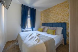 A bed or beds in a room at Via Macci, 59 - Florence Charming Apartments - Stylish apartments in a vibrant neighborhood with so comfortable beds!