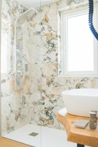a bathroom with a sink and a shower at Encanto Agriturismo & Private SPA in Visogliano