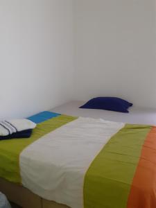 Ένα ή περισσότερα κρεβάτια σε δωμάτιο στο Pousada Acolhedora
