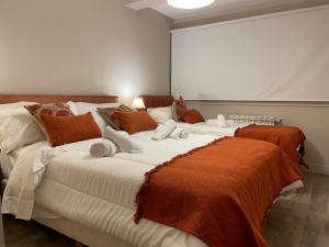 Llit o llits en una habitació de CATEDRAL SUITES