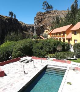 Der Swimmingpool an oder in der Nähe von Hotel El Refugio