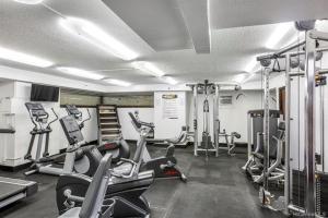a gym with several treadmills and cardio machines at Hawaiian Monarch 2108 condo in Honolulu
