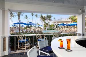 A restaurant or other place to eat at Opal Grand Oceanfront Resort & Spa