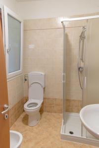 Koupelna v ubytování Residence TANA - via Pasubio