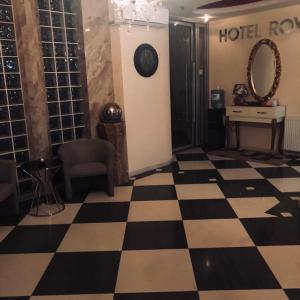 a hotel room with a checkered floor at Hotel Royal in Tetovo
