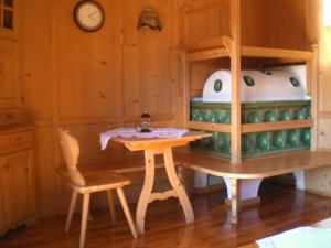 a toy kitchen with a table and a stove at Schiedhof in Castelrotto